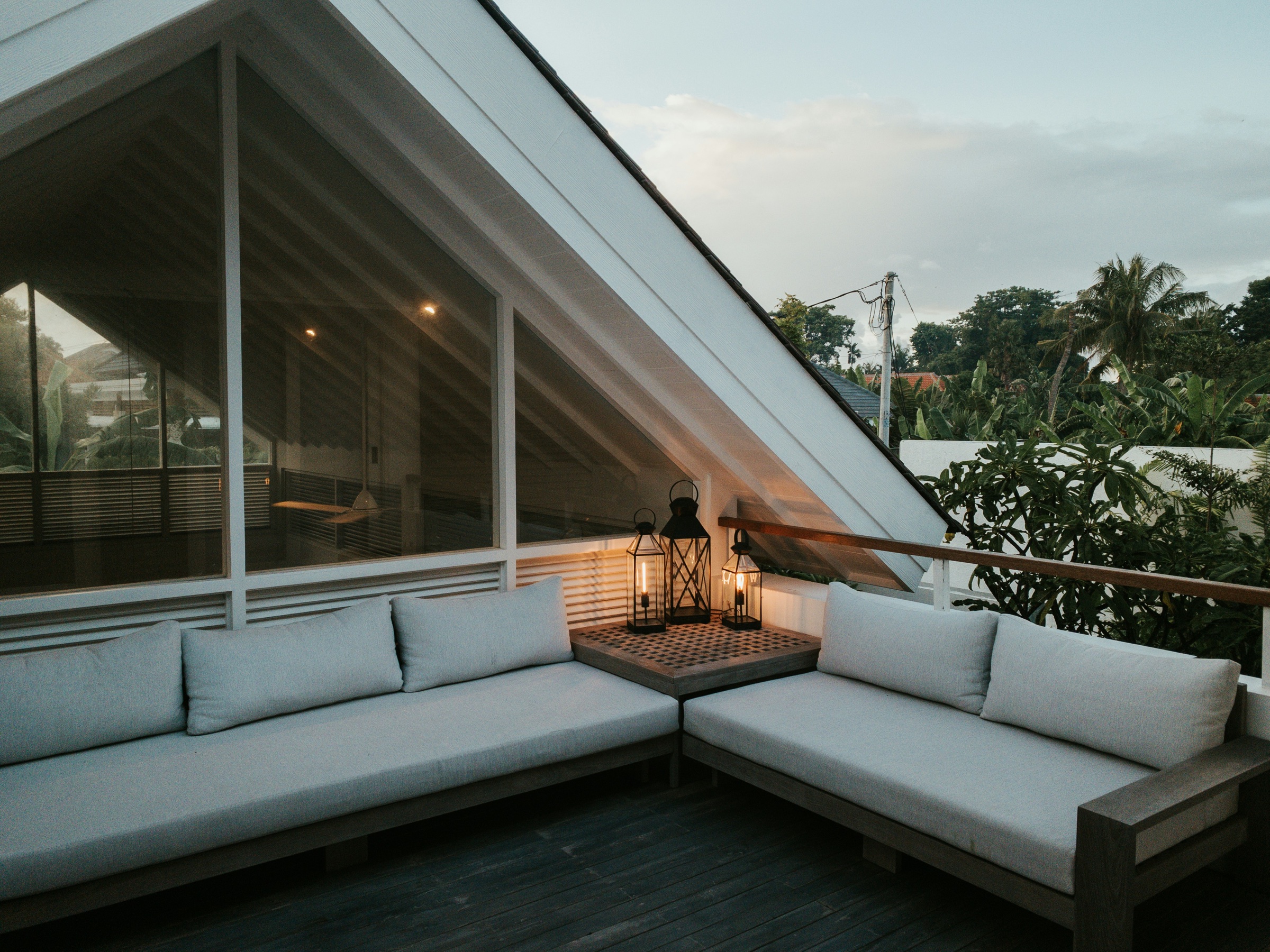 Private villa terrace at dusk with lanterns
